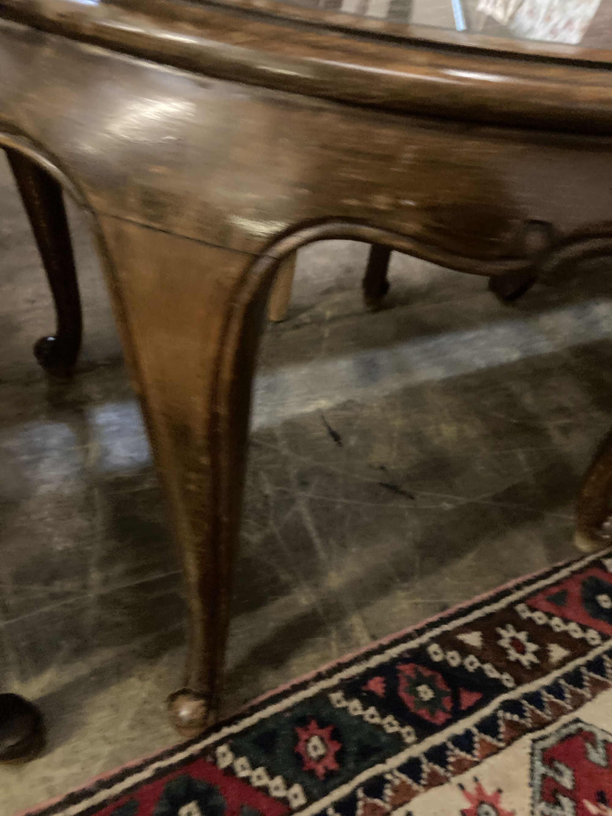 A 1920s circular caned beech occasional table, diameter 76cm, together with a pair of elbow chairs, one with a later tapestry seat